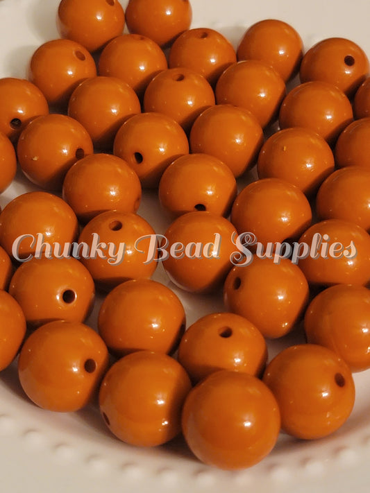 Perles solides orange brûlé de 20 mm